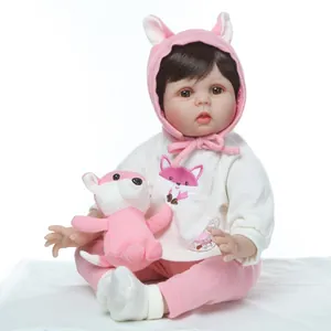 Realistic silicone baby doll with pink fox embroidery outfit and plush toy accessory