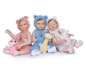 Three lifelike full silicone reborn baby dolls in pastel knits with plush animal toys