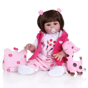 Lifelike reborn baby doll in pink hoodie with giraffe plush and pacifier accessories