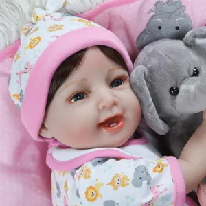 Close-up of lifelike silicone reborn baby doll with blue eyes and giraffe pattern hat