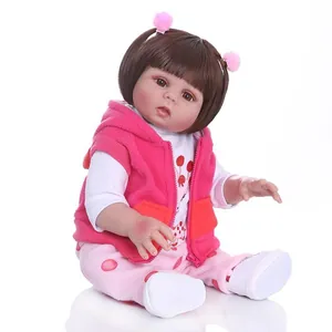 48cm NPK reborn baby doll with brown hair and pink fleece hooded vest on white background