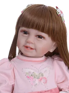 Close-up of lifelike girl doll featuring long brown hair and pink sequined butterfly top