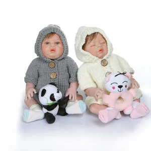 Realistic twin reborn baby dolls in knitted outfits with plush panda and bear accessories