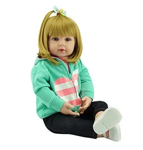 Close-up of a 60cm lifelike reborn baby doll with blonde hair and heart hoodie