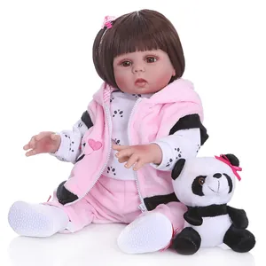 Realistic 48cm reborn baby doll in pink panda outfit with plush toy on white background
