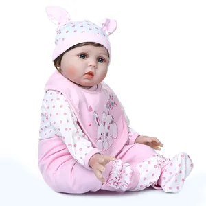 Lifelike reborn baby doll in pink bunny outfit with best friends bib and cute hat