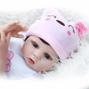 Realistic 47cm reborn baby doll with blue eyes and pink knit animal hat for kids