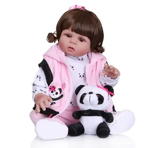 Realistic 47cm full body silicone reborn doll in pink outfit with plush panda toy