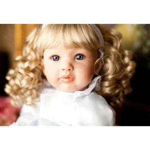 Lifelike 60cm reborn toddler baby doll with blonde curly hair and blue lace dress