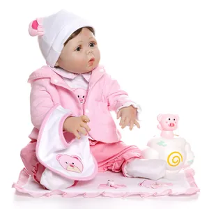 55cm lifelike reborn doll in pink outfit with pacifier and plush accessory