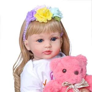 Realistic 24-inch reborn toddler girl doll with blonde hair and plush teddy bear