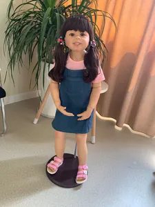 Detailed full-body view of a 98cm lifelike toddler girl doll in denim dress and pink shoes