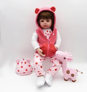 Detailed set of 47cm reborn baby doll with polka dot outfit and giraffe plush toy