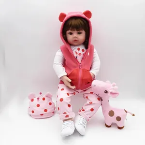 Lifelike 47cm reborn toddler doll with pink outfit and giraffe plush toy on white background