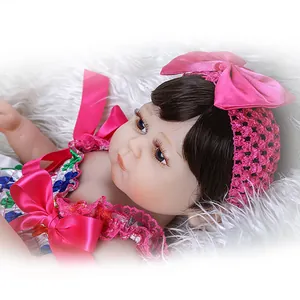 Realistische 48cm Silikon Reborn Baby Puppe mit rosa Schleife und Blumenoutfit