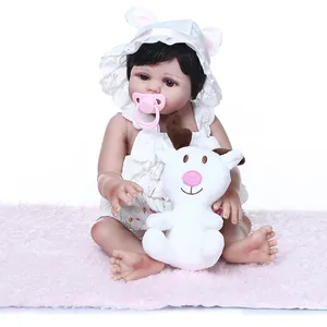 Realistic 47cm reborn doll in white lace romper with bunny ear hat and plush deer