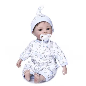 Detail of 30cm reborn baby doll in blue bird print outfit with matching hat and pacifier