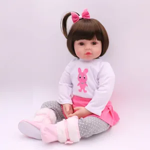 Lifelike 47cm silicone reborn baby doll wearing a pink rabbit outfit and soft boots
