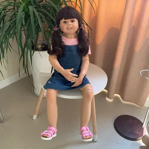 Detail of 98cm toddler reborn doll with twin ponytails wearing pink tee and denim skirt
