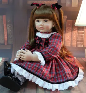 Detailed view of 60cm reborn toddler doll in red plaid dress and lace details
