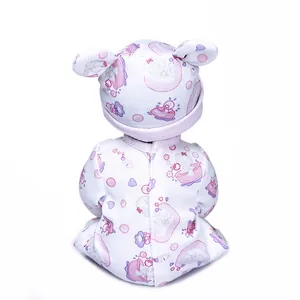Rear view of 30cm lifelike baby doll in pink floral jumpsuit with bear-eared hat