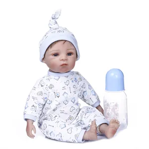 Detailed view of 30cm reborn baby doll with blue eyes and matching bird print outfit