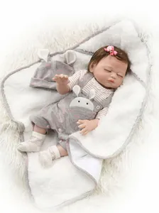 Detailed close-up of 48cm reborn doll in pink striped shirt and bunny sleepwear