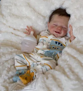 Detailed close-up of a smiling reborn doll's face with realistic skin texture on soft rug