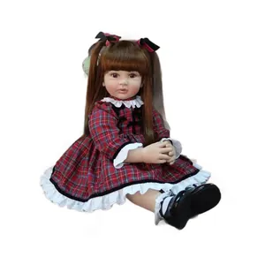 Realistic 60cm reborn toddler doll with long brown hair in a red plaid lace dress
