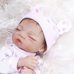 30cm realistic reborn baby doll in pink heart onesie sleeping on plush carpet