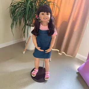 Realistic 98cm girl reborn doll with brown pigtails in pink shirt and denim dress