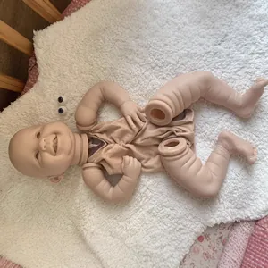 Lifelike 22-inch smiling reborn doll DIY kit with soft vinyl head, limbs, and eyes on plush rug