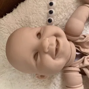 22-inch lifelike reborn doll kit with unpainted vinyl head, limbs and blue eyes on plush