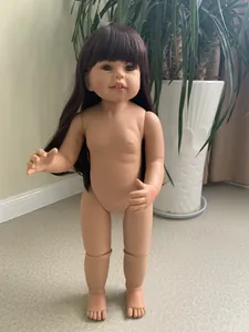 Detailed macro view of a 70cm realistic jointed child doll with long brown hair and bangs