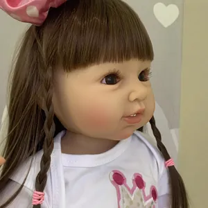 55cm lifelike reborn toddler doll with long brown hair and pink bow hair accessory
