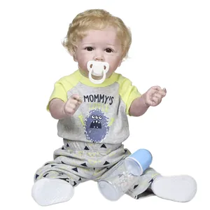 Detailed close-up of reborn toddler Saskia with pacifier, baby bottle, and soft curly hair