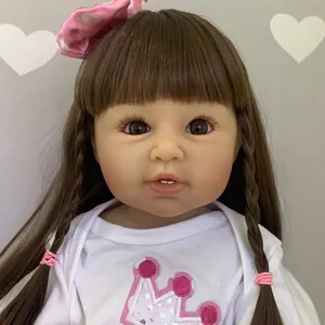 55cm lifelike reborn toddler doll with long brown hair and pink crown embroidery outfit