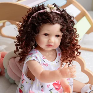 Reborn princess doll with curly hair wearing a floral headband and strawberry dress