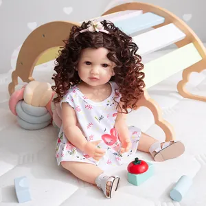 55cm lifelike reborn doll with curly hair wearing a white heart dress and floral headband