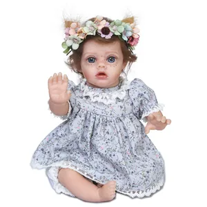 Poupée bébé reborn réaliste avec yeux bleus, bandeau fleuri et robe à fleurs