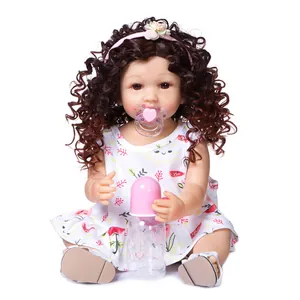 55cm lifelike reborn baby doll with curly brown hair, floral dress and nursing accessories