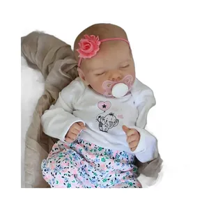 18 inch sleeping reborn baby doll with floral headband and elephant pattern outfit