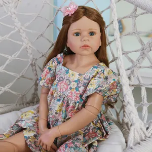 Lifelike 98cm masterpiece reborn doll with long brown hair in a floral puff sleeve dress