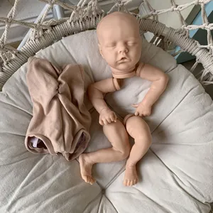 DIY Reborn Doll kit including vinyl head limbs and soft cloth body on white padding