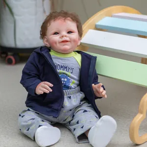Lifelike 55CM Reborn Baby Doll Shaya Boy with brown curls and blue hooded jacket
