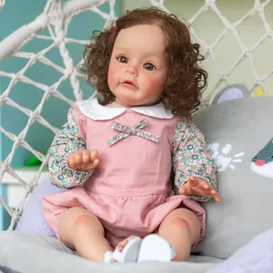 Lifelike 60cm reborn princess doll with curly brown hair in pink floral dress and sandals
