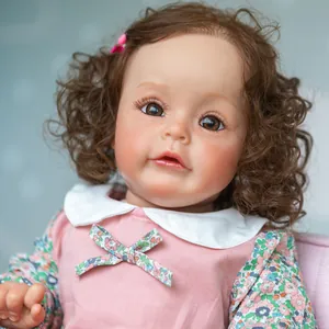 Close-up of a 60cm realistic princess doll with curly hair and a pink floral dress