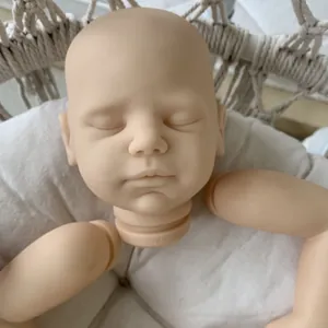 20 inch Viviana reborn doll kit featuring sleeping head and soft silicone limbs in a cradle