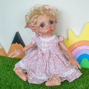 Exotic 40cm fairy doll with blonde curly hair and pink floral dress on green lawn