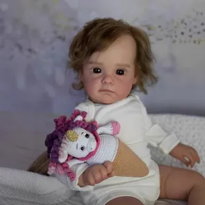 60cm realistic reborn baby doll Maggi with brown curly hair and crochet toy